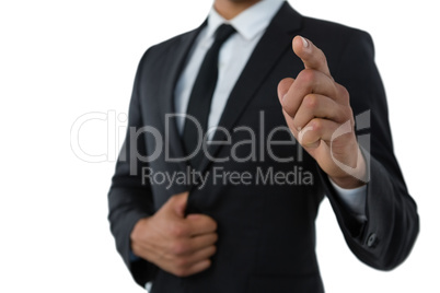 Mid section of businessman pointing