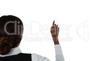 Rear view of businesswoman touching invisible screen