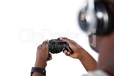 Man playing video game against white background