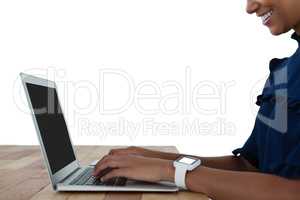 Businesswoman using laptop on the table