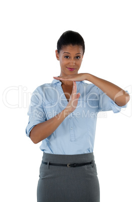 Businesswoman making a timeout hand gesture