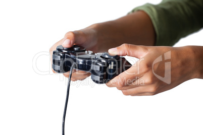 Woman playing video game against white background