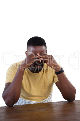 Upset man against white background