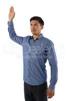 Businessman with arms raised