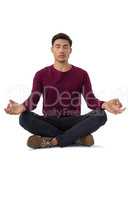 Full length of businessman meditating