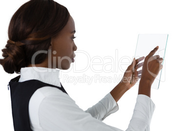 Side view of businesswoman using glass interface