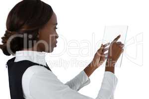 Side view of businesswoman using glass interface