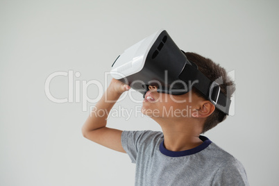 Schoolboy using virtual reality headset