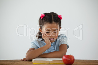 Young girl reading a book