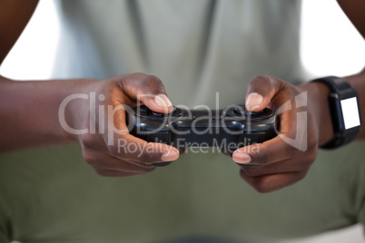 Man playing video game against white background