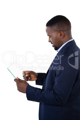 Businessman using a glass digital tablet