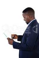 Businessman using a glass digital tablet