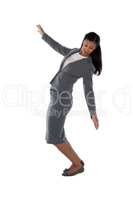 Businesswoman balancing while walking