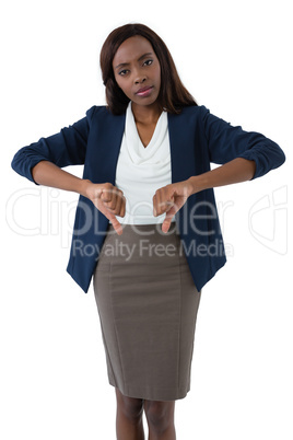 Portrait of businesswoman showing thumbs down