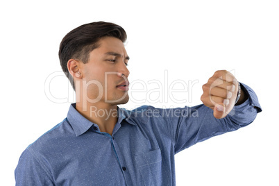 Businessman looking at wristwatch