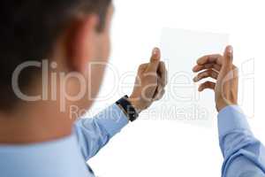 Cropped image of businessman using transparent glass interface