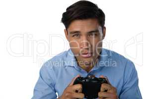 Close up portrait of businessman playing video game