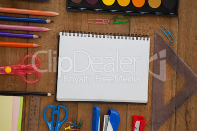 Various school supplies on wooden table