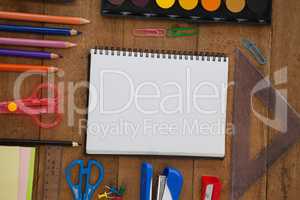 Various school supplies on wooden table