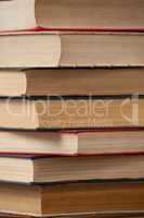 Stack of books against blue wooden background