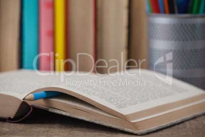 Book on wooden background