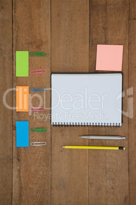 Various school supplies arranged on wooden table