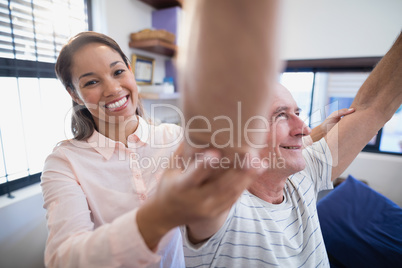 Portrait of smiling female doctor with senior male patient Portrait of smiling female doctor with senior male patient