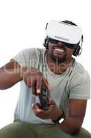 Man using virtual reality headset and playing video game