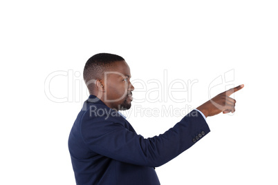 Businessman pressing an invisible virtual screen