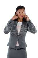 Irritated businesswoman covering her ears