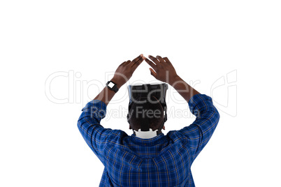 Man gesturing while using virtual reality headset