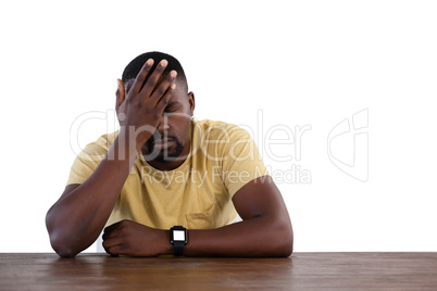 Upset man against white background