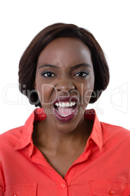 Portrait of young woman shouting