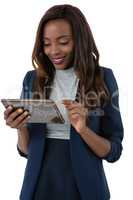 Happy businesswoman using tablet computer