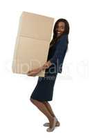 Portrait of businesswoman carrying cardboard boxes