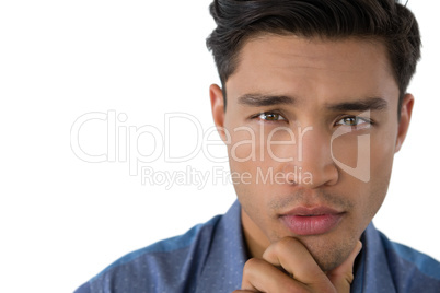 Close up portrait of businessman with hand on chin