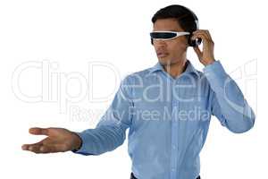 Young businessman using smart glasses