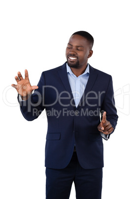 Businessman pressing an invisible virtual screen