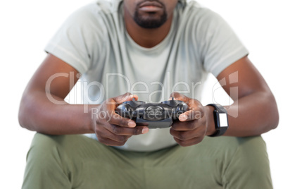 Man playing video game against white background