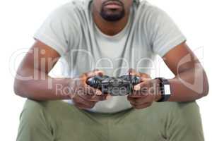 Man playing video game against white background