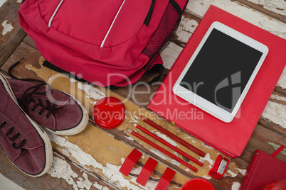 Bagpack, shoes, digital tablet and stationary