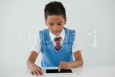 Schoolboy using digital tablet