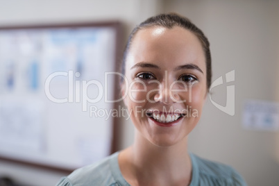 Close-up portrait of smiling young female therapist