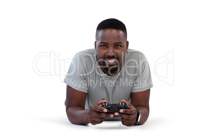 Man playing video game against white background