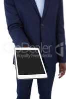 Businessman holding digital tablet