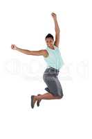 Excited businesswoman jumping in the air
