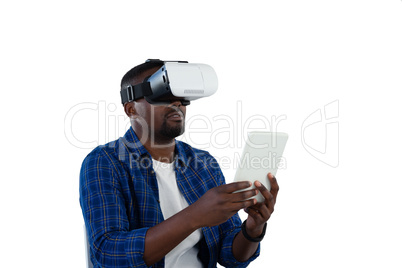 Man using virtual reality headset and digital tablet