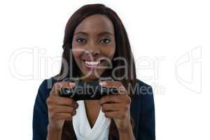 Close up of businesswoman playing video game