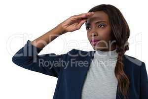 Close up of businesswoman shielding eyes