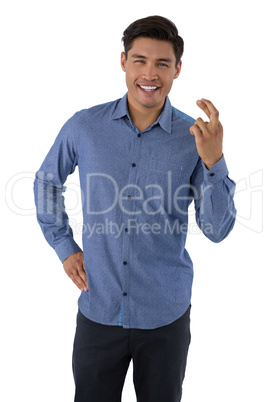 Portrait of smiling businessman showing crossed fingers